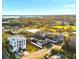 Expansive aerial view captures this elegant three-story home set within a vibrant landscape near the water at 3087 Cherry Ln, Clearwater, FL 33759