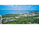 Majestic aerial view reveals a picturesque waterfront landscape dotted with lush greenery and upscale properties at 3087 Cherry Ln, Clearwater, FL 33759