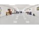 Large basement with white floors offers lots of open space for storage and activities at 3087 Cherry Ln, Clearwater, FL 33759