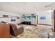 Spacious media room with comfortable seating and cinema-themed decorations at 3087 Cherry Ln, Clearwater, FL 33759