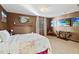 A luxurious bedroom featuring a flat-screen TV, soft lighting, and plenty of space at 3087 Cherry Ln, Clearwater, FL 33759
