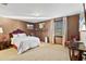 A luxurious bedroom featuring warm colored walls, and a flat-screen TV at 3087 Cherry Ln, Clearwater, FL 33759