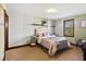 Comfortable bedroom boasts neutral tones, soft carpet, and natural light at 3087 Cherry Ln, Clearwater, FL 33759