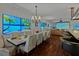 Dining room with large displays, dining table, and view into the living room at 3087 Cherry Ln, Clearwater, FL 33759