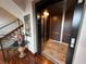An open elevator with wood paneling and stainless steel features in a room with a staircase at 3087 Cherry Ln, Clearwater, FL 33759