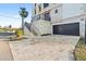 Exterior showcasing stone driveway, garage and front entrance with stairway to entrance at 3087 Cherry Ln, Clearwater, FL 33759