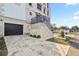 Elegant building exterior with a stone driveway, garage and stairway to entrance at 3087 Cherry Ln, Clearwater, FL 33759