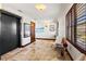 Entry hall with elevator access and seating with shuttered windows providing natural light at 3087 Cherry Ln, Clearwater, FL 33759