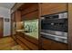 Kitchen detail showcasing stainless steel appliances, modern fixtures, and custom cabinetry at 3087 Cherry Ln, Clearwater, FL 33759