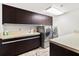 Well-equipped laundry room with modern appliances and ample cabinet space for storage at 3087 Cherry Ln, Clearwater, FL 33759