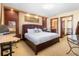 Spacious main bedroom featuring a king bed, desk, and ensuite bathroom for a luxurious retreat at 3087 Cherry Ln, Clearwater, FL 33759