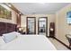 Comfortable main bedroom suite with ensuite bathroom and walk-in closet access at 3087 Cherry Ln, Clearwater, FL 33759
