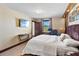 Luxurious main bedroom featuring designer headboard, stylish furnishings, and ensuite bathroom at 3087 Cherry Ln, Clearwater, FL 33759