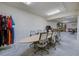 Spacious office area with conference table, storage racks, and race jackets for a unique workspace at 3087 Cherry Ln, Clearwater, FL 33759