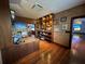 Modern office with built-in shelving, wooden floors, and ample natural light at 3087 Cherry Ln, Clearwater, FL 33759
