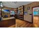 Modern office with built-in shelving, wooden floors, and ample natural light at 3087 Cherry Ln, Clearwater, FL 33759