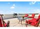 Relaxing rooftop patio with stylish outdoor seating and grill, perfect for entertaining and enjoying city views at 3087 Cherry Ln, Clearwater, FL 33759