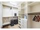 Organized walk-in closet offering ample storage with custom shelving and hanging space at 3087 Cherry Ln, Clearwater, FL 33759
