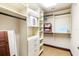 Bright closet with built-in shelving, drawers and hanging rods to keep items organized at 3087 Cherry Ln, Clearwater, FL 33759