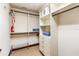 Functional closet with storage solutions, including shelves, drawers, and hanging rods at 3087 Cherry Ln, Clearwater, FL 33759
