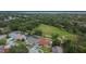 An aerial showcases the community's homes and large, central green space, highlighting the beautiful setting at 3092 Hillside Ln, Safety Harbor, FL 34695
