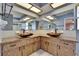Bathroom featuring dual sinks, granite countertops and natural lighting at 3092 Hillside Ln, Safety Harbor, FL 34695