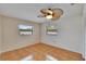 Inviting bedroom featuring wood floors and a contemporary ceiling fan at 3092 Hillside Ln, Safety Harbor, FL 34695