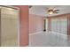 Spacious bedroom boasts tile floors, ceiling fan, and natural light at 3092 Hillside Ln, Safety Harbor, FL 34695
