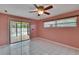 Bedroom featuring a ceiling fan, and access to pool at 3092 Hillside Ln, Safety Harbor, FL 34695