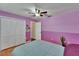Bedroom featuring a closet, wood-look floors, and plenty of natural light at 3092 Hillside Ln, Safety Harbor, FL 34695