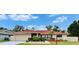 Charming single-story home featuring a red roof, well-maintained landscaping, and an attached two-car garage at 3092 Hillside Ln, Safety Harbor, FL 34695