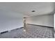 Bright and spacious living room area showcasing tile flooring and fresh gray paint at 3092 Hillside Ln, Safety Harbor, FL 34695