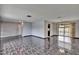 Open-concept living space with access to the pool area and features elegant tile flooring at 3092 Hillside Ln, Safety Harbor, FL 34695