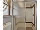 Modern shower with decorative tile and glass door at 3092 Hillside Ln, Safety Harbor, FL 34695