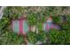 An aerial view shows well-maintained tennis courts surrounded by lush greenery, a sporty community amenity at 3092 Hillside Ln, Safety Harbor, FL 34695