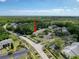 Aerial view of a condo community surrounded by lush greenery, with ample parking at 3188 Lake Pine S Way # B1, Tarpon Springs, FL 34688