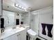 Bathroom featuring a white vanity and a shower with a glass door at 3188 Lake Pine S Way # B1, Tarpon Springs, FL 34688