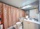 Bathroom featuring neutral paint, a shower with patterned curtain, and modern vanity at 3188 Lake Pine S Way # B1, Tarpon Springs, FL 34688