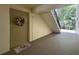 Condo doorway with a decorative wreath and a floral doormat creating a welcoming entrance at 3188 Lake Pine S Way # B1, Tarpon Springs, FL 34688
