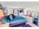 Bedroom featuring a plush bed, hardwood floors, ample storage, and natural light from two windows at 3188 Lake Pine S Way # B1, Tarpon Springs, FL 34688