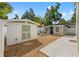 Exterior backyard view with stone ground and a large white shed at 3505 N Dartmouth Ave, Tampa, FL 33603