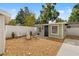 A cozy backyard features a fire pit, adirondack chairs, and stylish landscaping at 3505 N Dartmouth Ave, Tampa, FL 33603