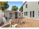 Backyard view with stone ground, a firepit, and cozy adirondack chairs at 3505 N Dartmouth Ave, Tampa, FL 33603