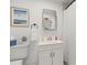 A classic bathroom with modern fixtures including a rectangular mirror at 3505 N Dartmouth Ave, Tampa, FL 33603