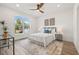Serene bedroom featuring a comfortable bed, stylish decor, and a large window at 3505 N Dartmouth Ave, Tampa, FL 33603