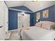 Comfortable bedroom features a view of the ensuite bathroom and closet at 3505 N Dartmouth Ave, Tampa, FL 33603