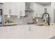 Bright kitchen featuring a quartz countertop island, stainless steel appliances and ample cabinet space at 3505 N Dartmouth Ave, Tampa, FL 33603