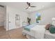 Inviting main bedroom showcasing hard flooring, neutral walls, and an ensuite bathroom at 3505 N Dartmouth Ave, Tampa, FL 33603