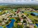 Aerial view showcases the neighborhood's desirable location with golf course and water views at 3726 Rain Tree Ct, Palm Harbor, FL 34685