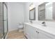 Modern bathroom with a glass enclosed shower and double sink vanity, offering a bright and updated space at 3726 Rain Tree Ct, Palm Harbor, FL 34685